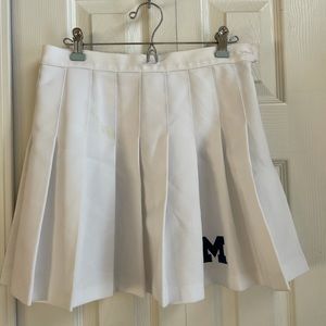 White cheer skirt with Michigan “M”